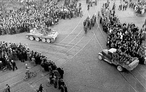 800px-Riga_1940_Soviet_ArmyA Soviet BT Tank with a truck and troops in the centre of Riga, 1940.